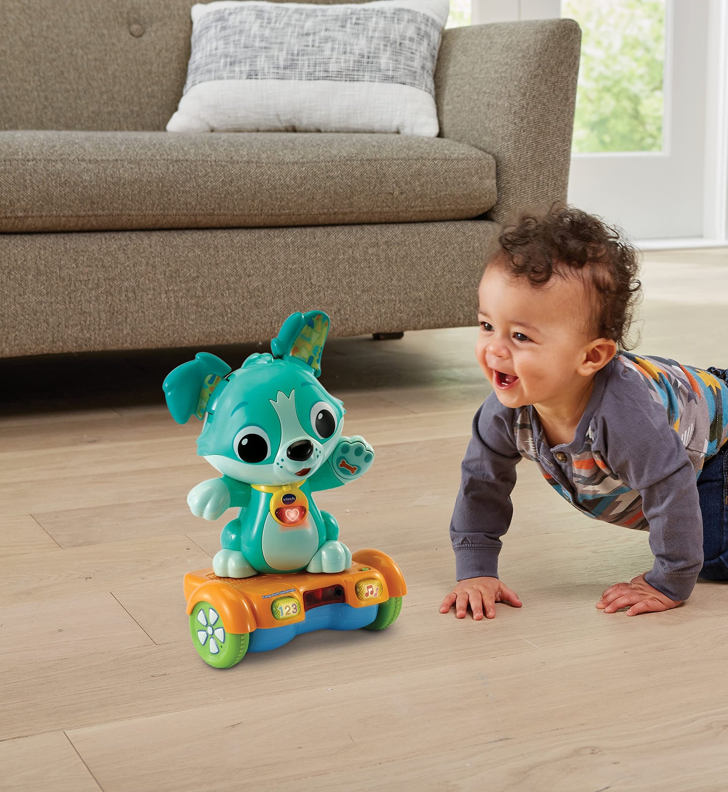 VTech Baby Câine Fang-mich – Hoverboard animat pentru mișcare – Cu urechi care se mișcă, melodii, sunete și conținut educativ – Pentru copii de 12-36 luni