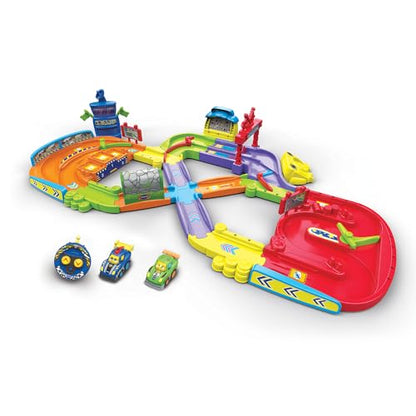 VTech - TUT TUT Bolides, Primul meu circuit de curse cu RC Auto Simon Super Champion și Auto Leo Bolide Turbo, 11 zone magice, Cadou pentru copii 1-5 ani