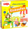 HABA Meine ersten Spiele Set de societate Cumpărături cu stand de piață 3D, bani de jucărie din lemn și liste de cumpărături de la 2 ani
